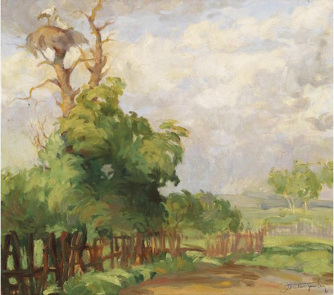 tree with stork's nest in a wide landscape